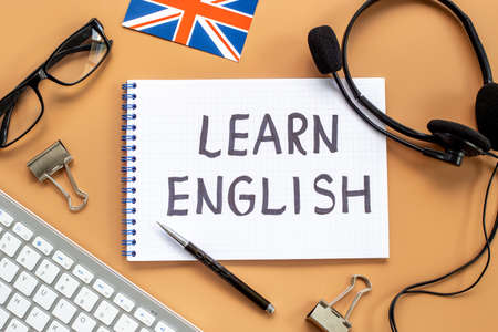 Learning English online lessons concept. Text on student tableの写真素材