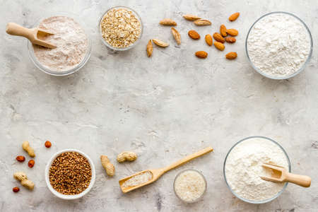 Bowls of various gluten free flour - almond peanut oat and rice buckwheat flourの写真素材