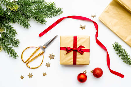 Christmas gifts background - golden gift boxes with red ribbonの写真素材