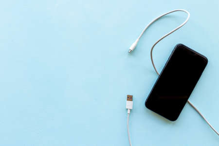 Usb cable for charging smartphone or laptop, top viewの写真素材