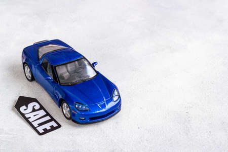 Sale of cars. Price sale label with small car modelの写真素材