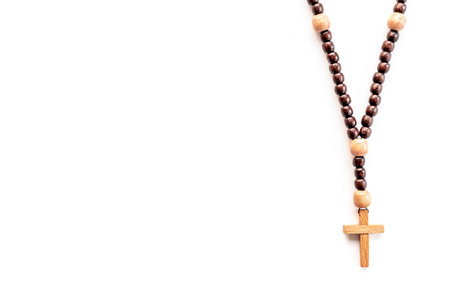 Close up of christian rosary beads with cross. Faith and prayer concept