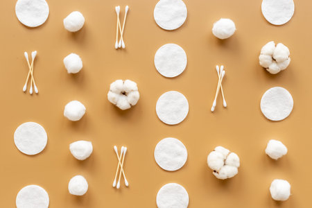 Cotton cosmetic makeup supplies - balls with cotton pads, top view