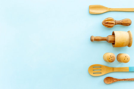 Cooking pattern with wooden kitchen utensils and cookware