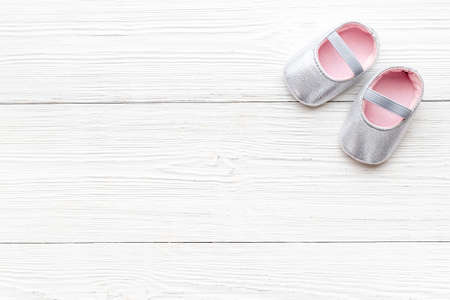 Baby girl pink newborn booties - baby shower party backgroundの写真素材