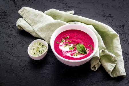 Cream soup made of red beet roots with basilの写真素材