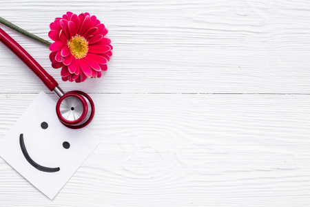 Breast cancer and women health background with red flower