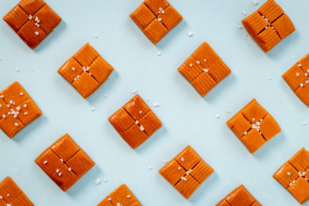 Homemade caramel candies pattern top view. Sweets background