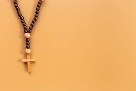 Close up of christian rosary beads with cross. Faith and prayer conceptの写真素材