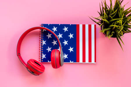 USA flag on notebook with headphones. E-learning language conceptの写真素材