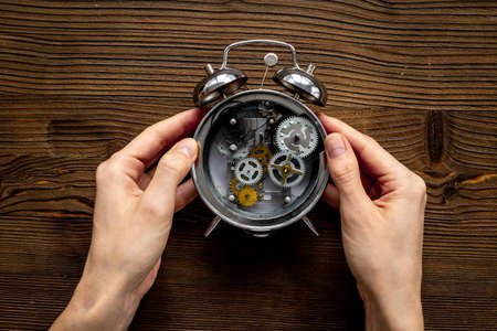 Watch mechanism with gears and wheels close up. Alarm clock mechanism