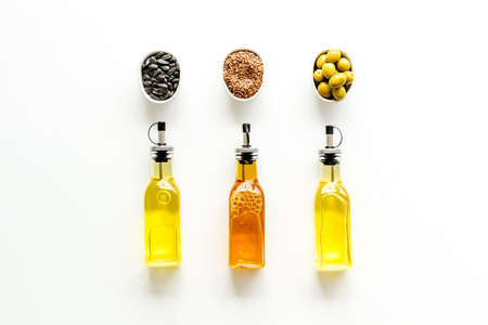 Different kind of cooking oil - sunflower olive and sesame oil with seedsの写真素材