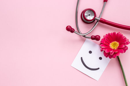 Women health background with red stethoscope and flowerの写真素材