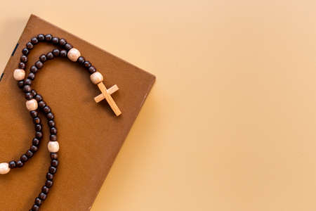 Rosary beads with cross on Bible book. Faith and prayer conceptの写真素材