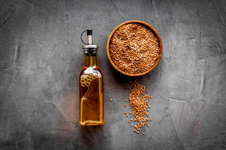 Sesame oil in bottle with ingredient - sesame seedsの写真素材