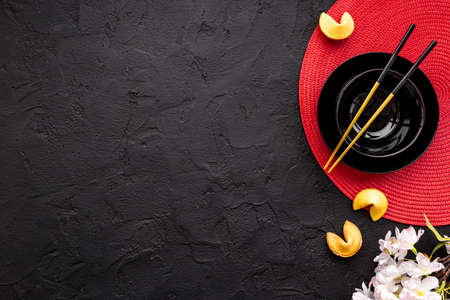 Asian table place setting with red bamboo mat for Chinese New Yearの写真素材