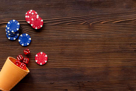 Red dices and gambling chips for poker. Casino games backgroundの写真素材