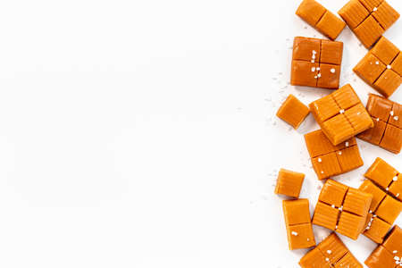 Caramel pieces of caramel candies with sea salt, top viewの写真素材