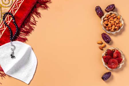 Ramadan background - Islamic prayer carpet with dates and rosaryの写真素材