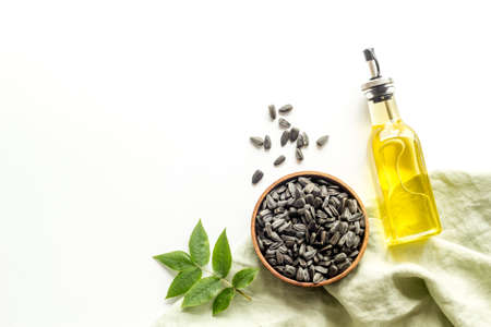 Sunflower cooking oil in bottle with ingredient - sunflower seedsの写真素材