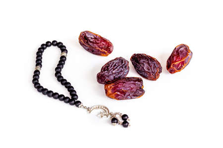 Ramadan Kareem background. Dates fruits and rosary with star and crescentの写真素材