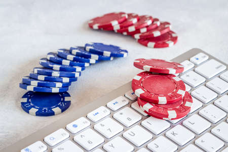 Poker chips with keyboard. Online casino games conceptの写真素材