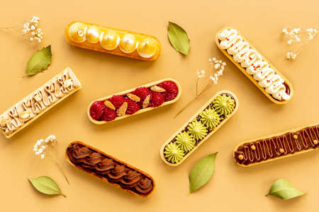 Bakery banner background of eclairs colorful topping.