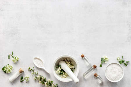 White organic cosmetics products with white flowersの写真素材