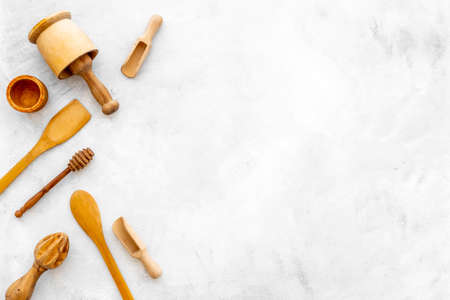 Flat lay of wooden kitchen utensils and cookware