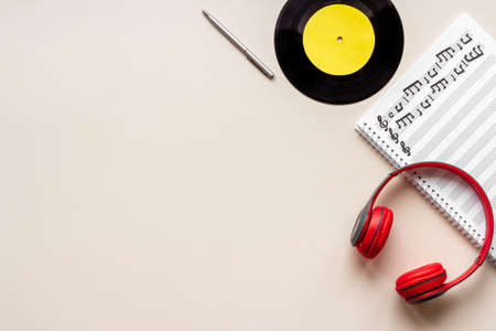 Music sheets with musical notes and headphones, top viewの写真素材