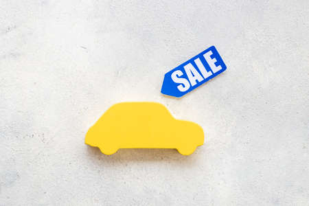 Sale label with small car model - sale of cars conceptの写真素材