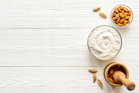 Pestle almond flour - nuts with mortar on kitchen tableの写真素材