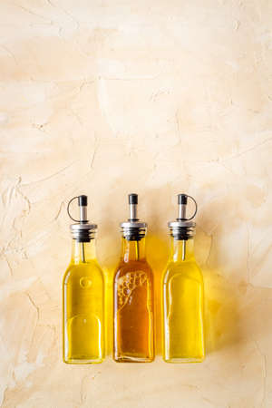 Sunflower olive and sesame cooking oil in bottlesの写真素材
