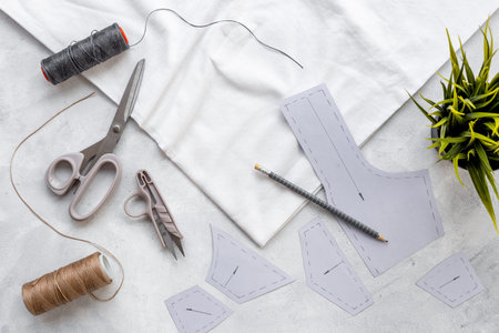 Sewing patterns with fabric - fashion designer table with tailor tools