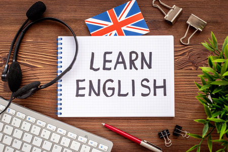 Learnging English concept. Handwritten text on notebook on student table
