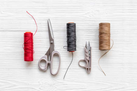 Tailoring scissors with bobbins of thread. Sewing backgroundの写真素材
