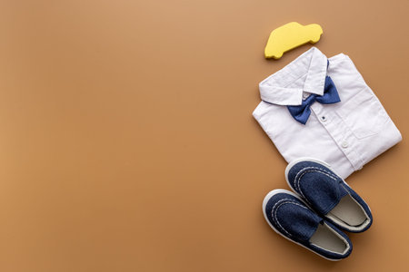 Baby boy blue shoes with bodysuit. Newborn set background