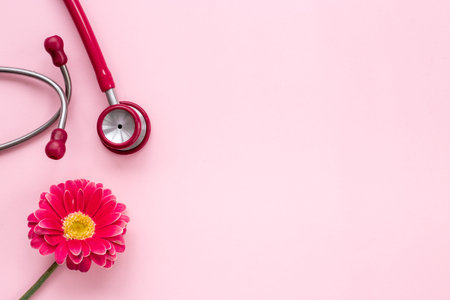 Breast cancer and women health background with red flowerの写真素材