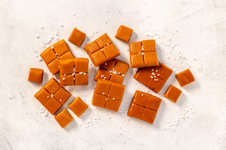 Caramel pieces of caramel candies with sea salt, top view