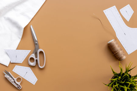 Sewing patterns with fabric - fashion designer table with tailor tools