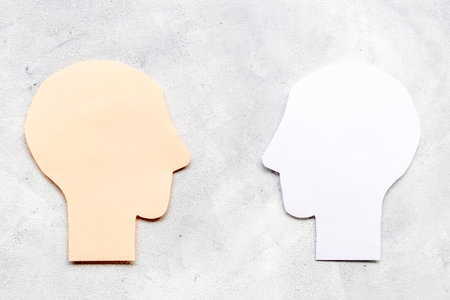 Social communication and connection concept with two paper human headsの写真素材