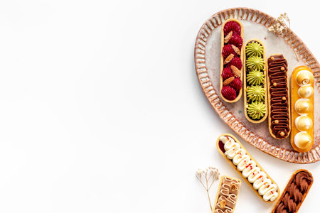 Set of delicious dessert eclairs with colorful topping