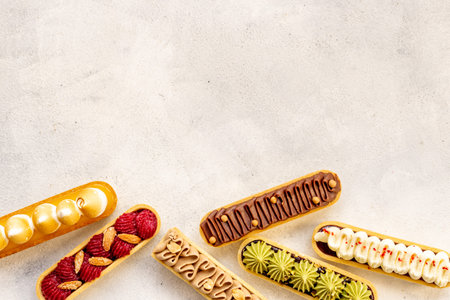 Group of decorated eclairs with pistachio raspberries and chocolate