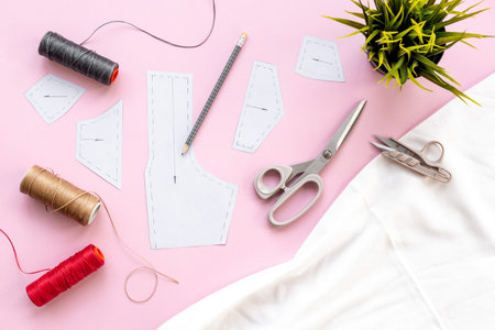 Sewing patterns with fabric - fashion designer table with tailor tools