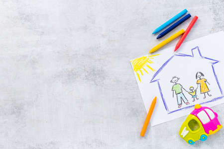 Drawing of parents and child at home. Adoption conceptの写真素材