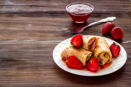 Hot french crepes with strawberry and berry sauce. Sweet dessertの写真素材