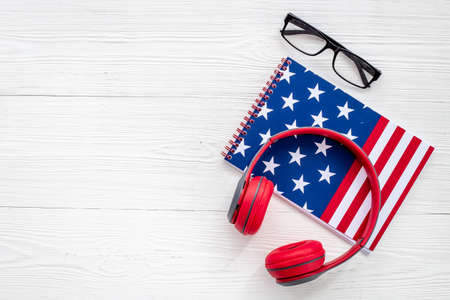 USA flag on notebook with headphones. E-learning language conceptの写真素材