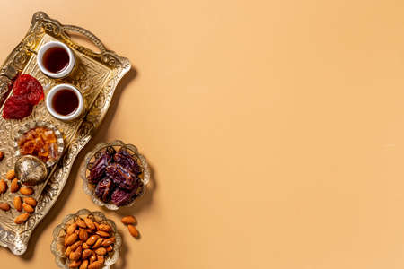 Islamic rosary with dates fruits and tea. Ramadan Kareem conceptの写真素材