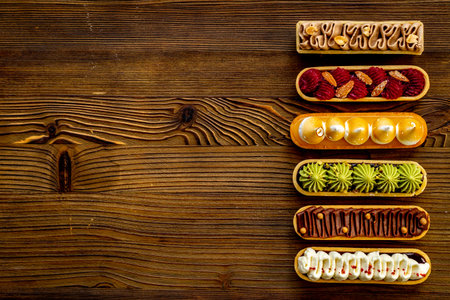Sweet food pattern of eclairs with color topping. Sweet shacks