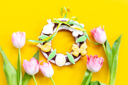 Easter bunny cookies with tulips flowers, top view